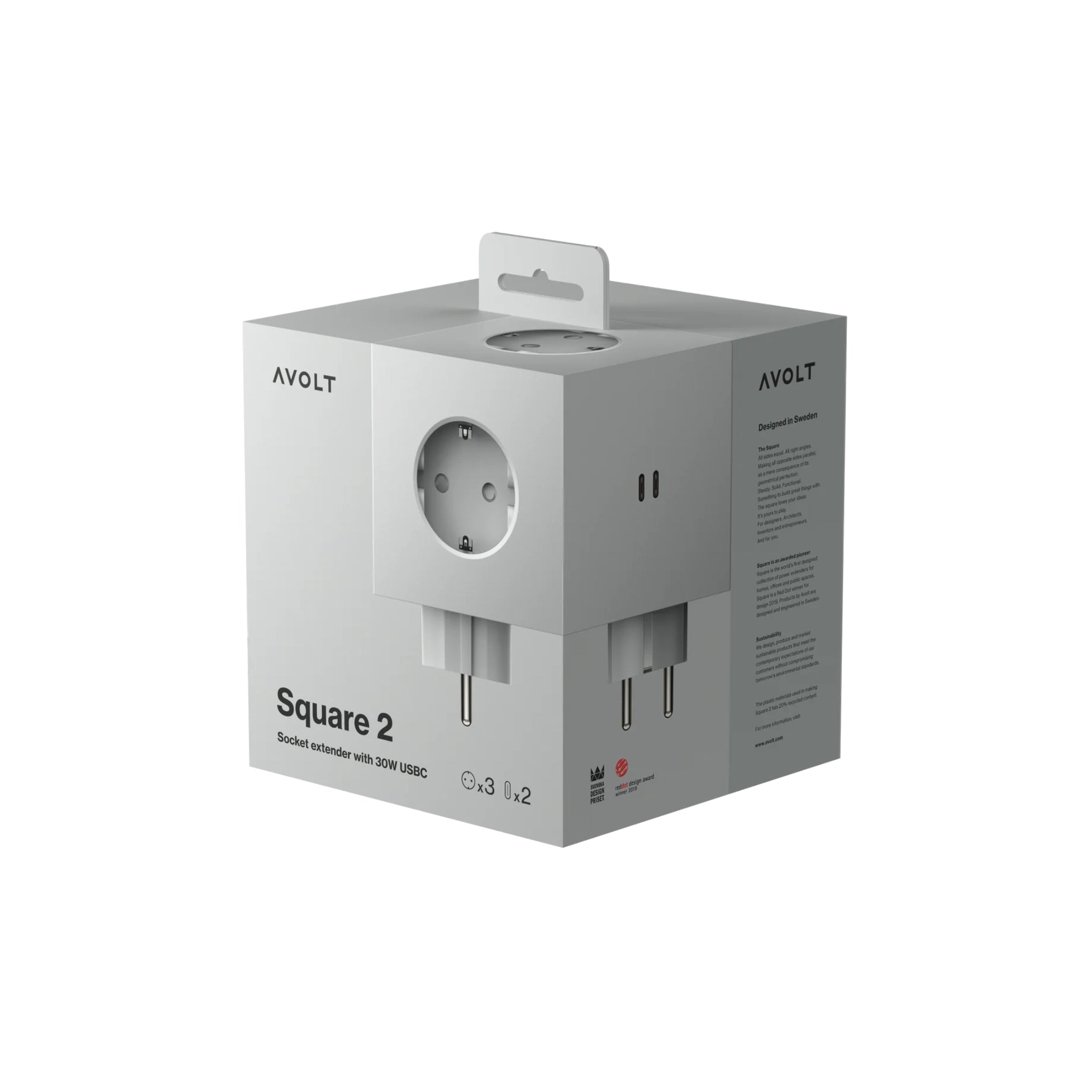 De Avolt Square 2 USB-C Stekkerdoos Gotland Grijs wordt getoond in zijn grijze verpakking, met productdetails en afbeeldingen van de witte stekkerdoos met 30W USB-C poorten op de voor- en zijkanten.