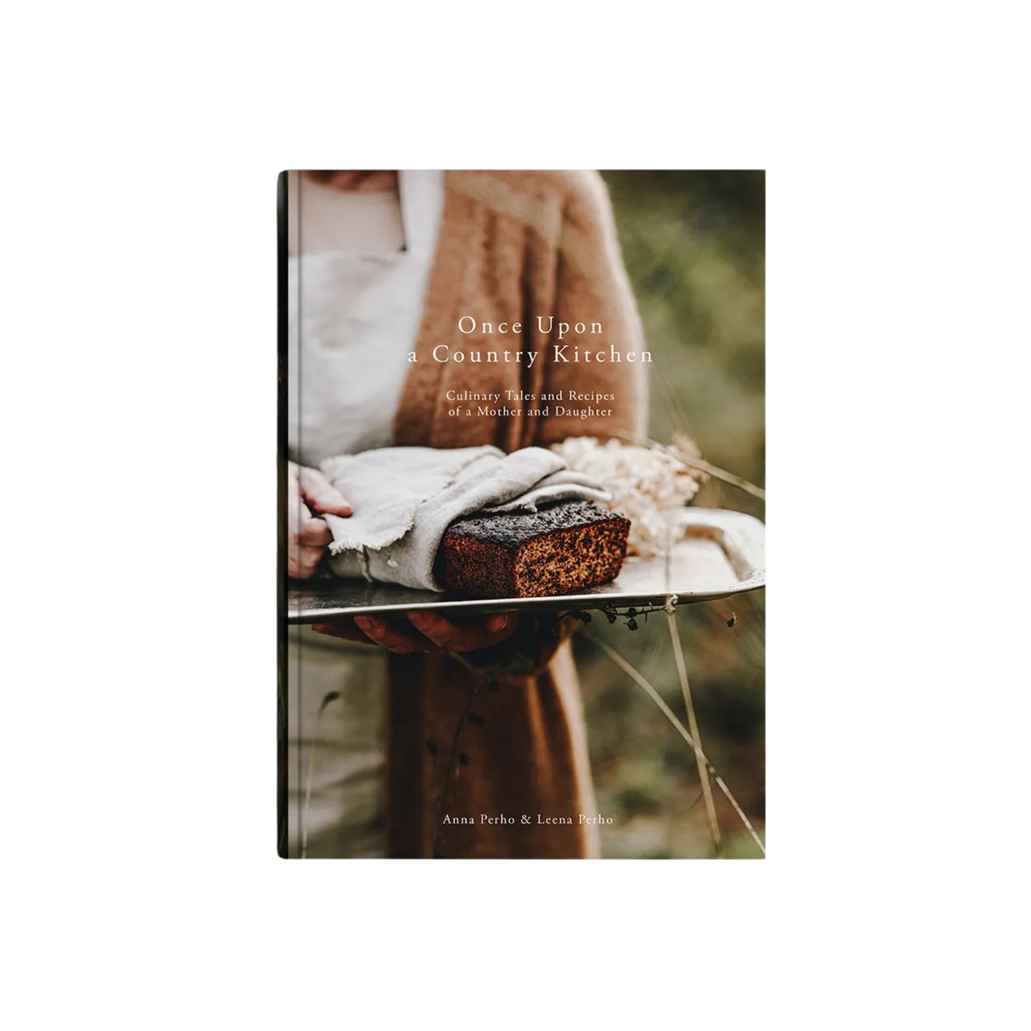Het Cozy Publishing Once Upon A Country Kitchen Kookboek heeft een rustieke cover met een persoon in boerderijkleding die brood vasthoudt in een veld, en benadrukt auteurs Anna en Leena Pasha, wat de gezellige Finse uitgeverij weerspiegelt.