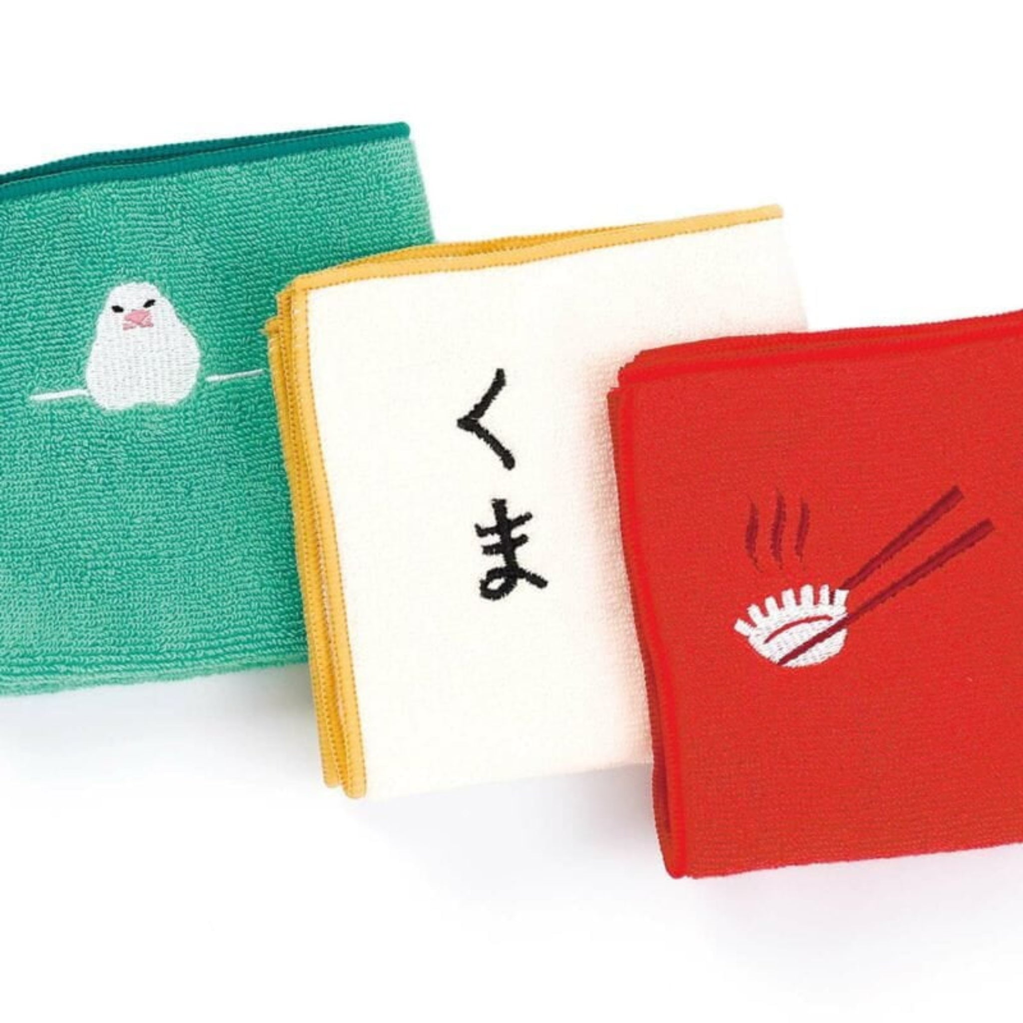De Hightide New Retro Handdoek Groen 25/25 is een Japanse vierkante katoenen handdoek met een groen dessin en een witte zegel, van het merk Hightide.