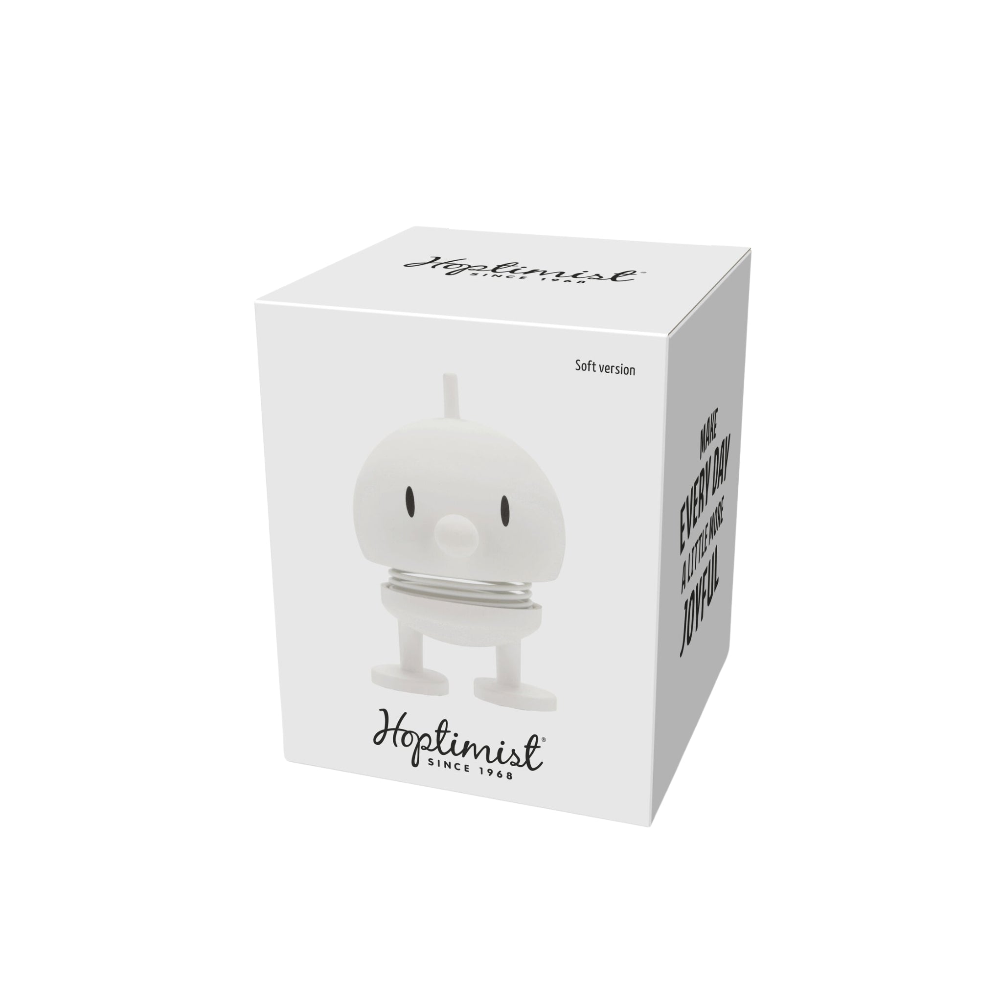 Een witte doos toont een afbeelding van de Hoptimist Soft Bumble S Wit van Hoptimist - een rond, wit beeldje met een verend lichaam, kleine armen en benen, een klassiek Deens ontwerp en "Hoptimist Since 1968" op de voorkant.