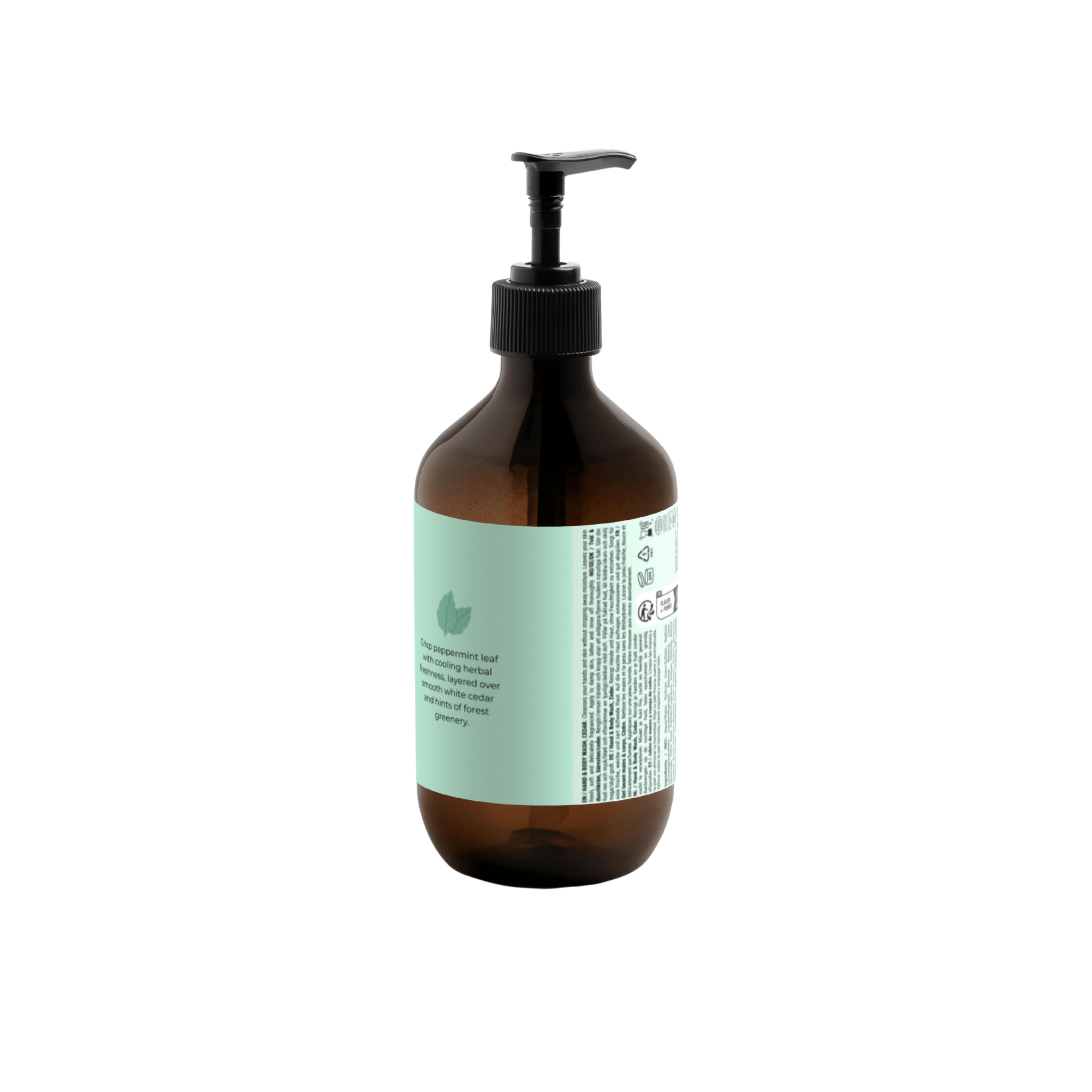 Een bruine pompflacon van Matriks Fragrances Hand & Body Wash Cedar & Mint (490 ml) met een lichtgroen etiket, schuin afgebeeld. De witte achtergrond benadrukt de details en het merk van het etiket, wat suggereert dat het veganistisch is.