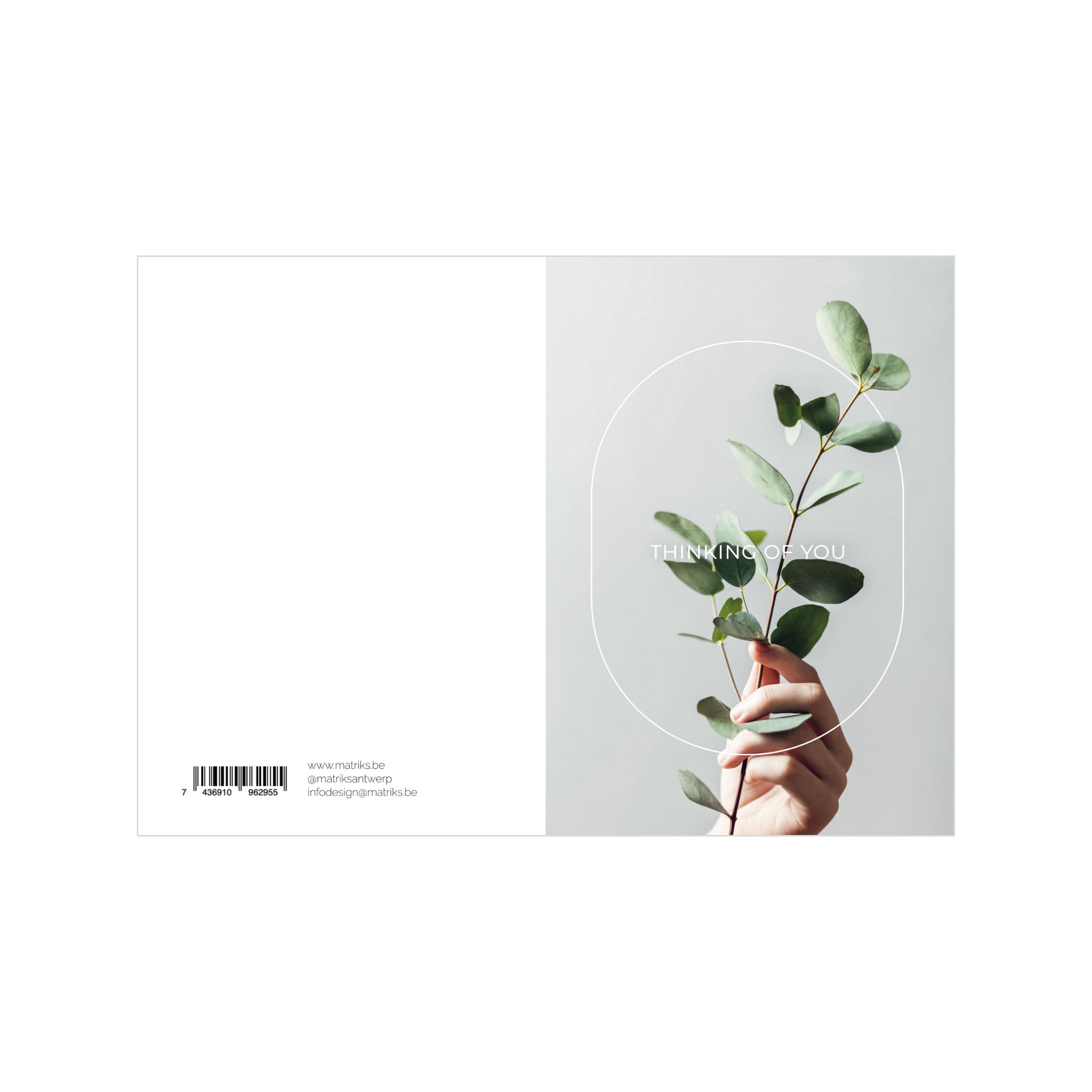 Een hand houdt een groene eucalyptustak vast tegen een lichte achtergrond. Op Matriks Postkaart Lijn Thinking Of You Dubbel A6 staat "THINKING OF YOU" in witte tekst, met een streepjescode plus kleine website- en social media-info aan de linkerkant.