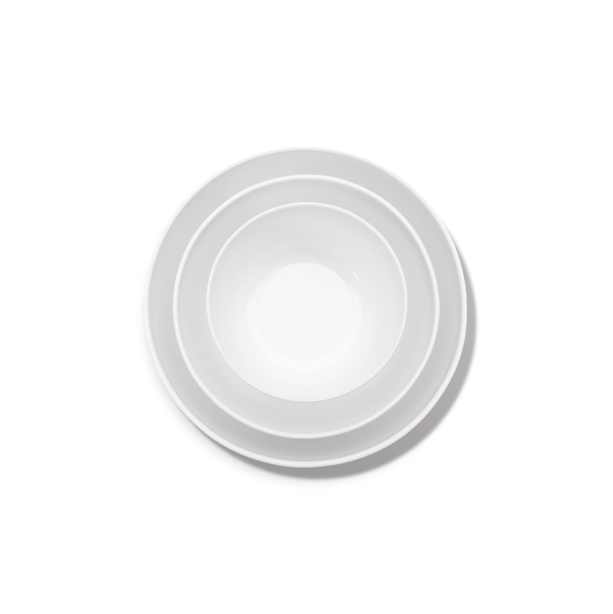 De Serax Base Hoge Kom D12, een kom van wit keramiek van Serax, wordt van bovenaf getoond tegen een effen witte achtergrond.