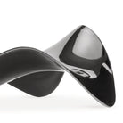 Een close-up van de Alessi Blip Lepelhouder van Alessi-een elegante, glanzend zwarte lepelhouder met gladde, abstracte rondingen geïnspireerd op Italiaans design, die lijkt op een gedraaid lint tegen een effen witte achtergrond.