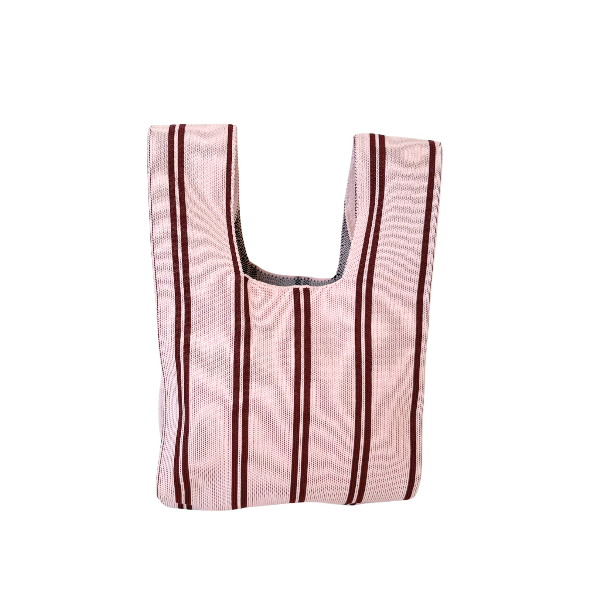 De Caro Antwerp Handtas Double Dash 2.0 Roland Larose is een herbruikbare geweven draagtas met verticale kastanjebruine strepen op een lichtroze achtergrond, ontworpen om stijlvol en duurzaam mee te nemen.