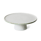 De HK Living 70s Ceramics Plateau/Taartschaal Smudge M is een witte keramische standaard met een brede, platte bovenkant en stevige voet, geïnspireerd op jaren 70 keramiek en afgebeeld tegen een effen witte achtergrond.