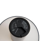 Close-up van de onderkant van de Hay Pao Tafellamp LED Oplaadbaar Zwart van Hay, met de aan/uit-knop, oplaadpoort en modelinformatie met certificeringssymbolen op een witte achtergrond.