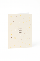 De Matriks Nieuwjaarskaart Happy New Year! van Matriks is een crèmekleurige kaart met gouden en bruine confetti-achtige stippen en lijnen, met "HAPPY NEW YEAR!" in het midden.