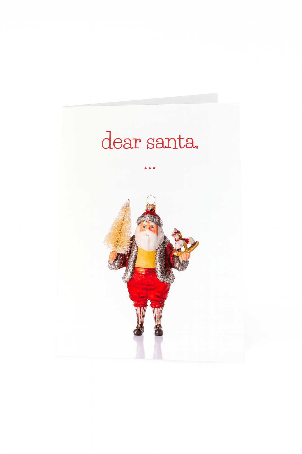 Op de Matriks Kerstkaart Beste Kerstman, ... van Matriks staat de Kerstman met een kerstboom en een hobbelpaard, ideaal om een grappige kerstgroet te versturen op een effen witte achtergrond.