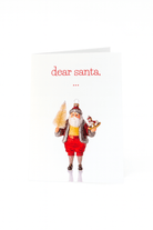 Op de Matriks Kerstkaart Beste Kerstman, ... van Matriks staat de Kerstman met een kerstboom en een hobbelpaard, ideaal om een grappige kerstgroet te versturen op een effen witte achtergrond.