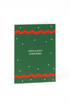 Stuur feestelijke wensen met de Matriks Kerstkaart Have a Jolly Christmas! van Matriks - een groene kaart met rode golvende randen, kleine witte stippen en "HAVE A JOLLY CHRISTMAS!" in het midden.