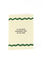 Stuur feestelijke groeten met de Matriks Kerstkaart "It's the Most Wonderful Time of the Year!"- een unieke crèmekleurige kaart met groene golvende lijnen, witte stippen en een vrolijke vakantieboodschap van Matriks.